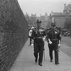 The Kings levee. Rear Admiral Evans of the Broke ( left ) leaving. 1 June 1928