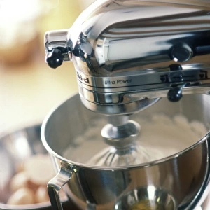 Kitchen aid mixer being used to make a cake
