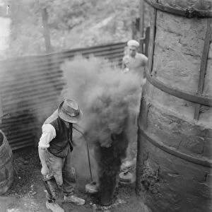The Lime works in Dunton Green, Kent. Workers stoke the fires in the kilns