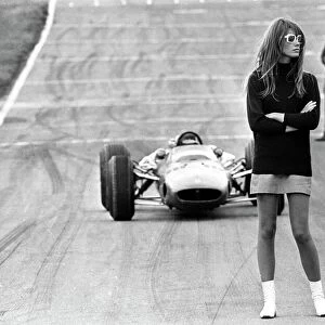 Look out, beautiful. Brands Hatch, England; Nonchalent hazard for racing drivers