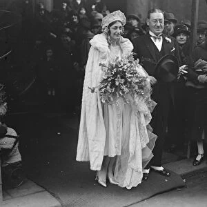 Lord Beaverbrooks sister weds. Miss Laura Aitken was married to Mr D M Ramsay
