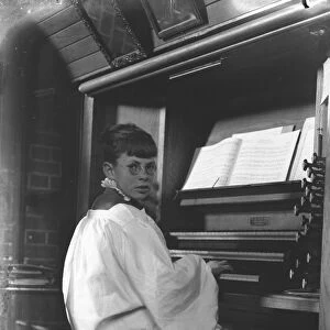 Master Ivor Keys at the organ of St Marys Parish church, Littlehampton, Sussex