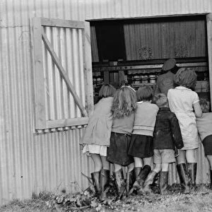 McConnel hinds, children watch the hop picking machine. 1937