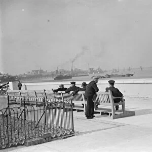 Men on benches enjoying the riversite view at Erith in Kent. 2 October 1937