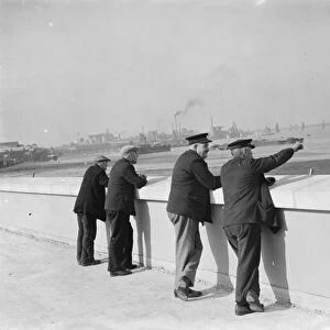 Men enjoying the riversite view over the River Thames at Erith in Kent