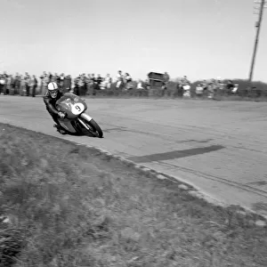Mettet, Belgium : Britains famous John Surtees riding his MV Augusta at the Internation