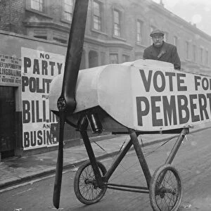 Mile End Election, Voter being taken to the booth in an aeroplane - Noel Pemberton