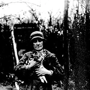 Miss Nancy Rutherford holding one of her many cats. (Otford) 1934