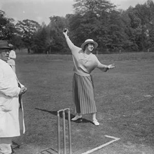 Miss Violet Loraine bowls the first ball at the opening match of the Langley Park