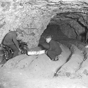 Motorcycle in caves at Chislehurst, Kent. Mushroom growing. 1934