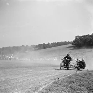 Motorcycle racing at Brands Hatch, Kent. A sidecar motorbike takes a corner