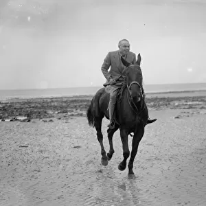 Mr Hore Belisha spends his holiday - on horseback. Away from transport problems