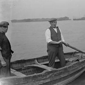 Mr J H Salmon, landlord of the Long Reach Tavern in Dartford, Kent, on a barge