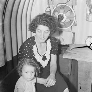 Mrs Ellis and Valerie Ellis sitting in an air raid shelter in Downham, Kent