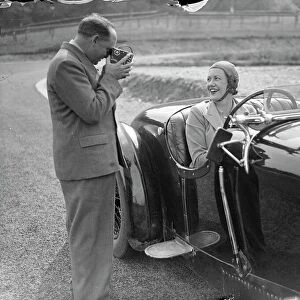 Mrs Roy ( Marjorie ) Eccles being filmed by her husband before racing on the track