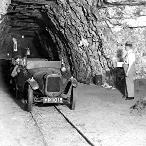 Mushroom growing at a Chislehurst cave. An Austin 7 is used for transport. 1934