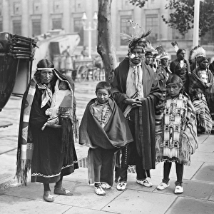 North American Indians arrive in England. An Indian Chief and his family outside