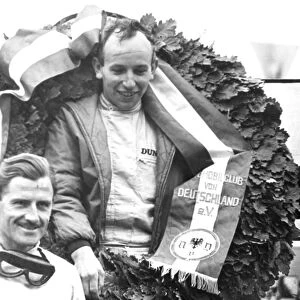 Nurburgring Germany John Surtees with a huge laurel wreath celebrates winning