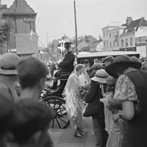 An old fashion wedding at Eltham Parish church. The bride arriving at the chance