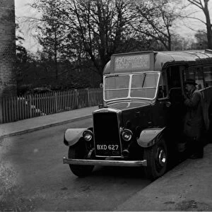 Passengers getting on to a London Transport diesel bus, Longfield. 1935