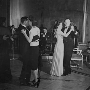 Passengers on the maiden voyage of the HMS Queen Elizabeth luxury liner, dancing
