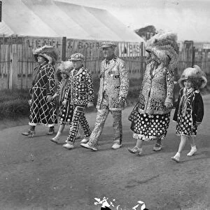 Pearly King and Queen at the Derby. A Royal family of Pearlies arriving on the