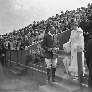 Polo at The Hurlingham Club, London - The Queen Queen presents the cup to Lord