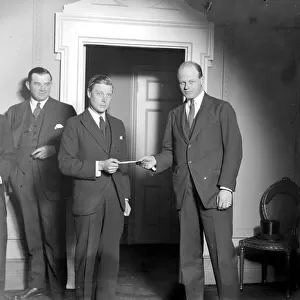 The Prince of Wales receives from Captain J. Potter Miss Marion Davies cheque for