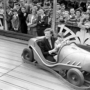 Princess Edward of Kent in a dodgem Car with his nanny at Agars Plough Slough. August