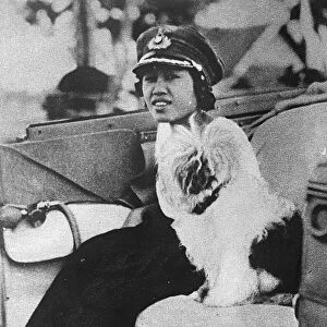 Queen as Colonel of the girl guides The Queen of Siam motoring to a rally of girl