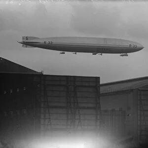 R 33 in taking off trial with two D H 53 Hummingbirds at Pulham. The airship above
