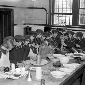 At the Royal Merchant Seamens Orphanage, Wokingham. Making the christmas pudding