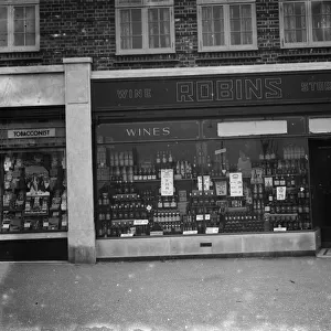 The shop front of Robins Off licence in Beckenham, Kent. 1 March 1936