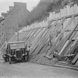 Shoring up a landslide with wooden braces in Dartford, Kent. 1938