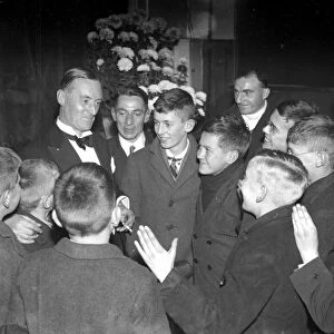 Sir M Campbell at Chislehurst, Kent, talking with youths. 1934