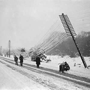 Snow havoc in Southern England. Telegraph poles blown over. The worst havoc of