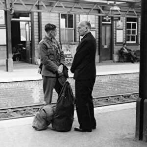 A soldier on his way to his unit. His father waits to say goodbye on Sidcup station