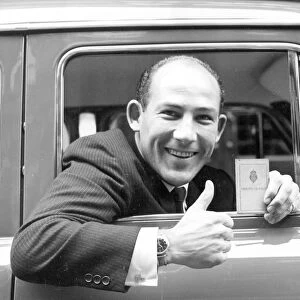 Stirling Moss with New Driving Licence after Year of Disqualification. he Celebrated