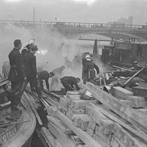 Timber barge on fire at Vauxhall, London