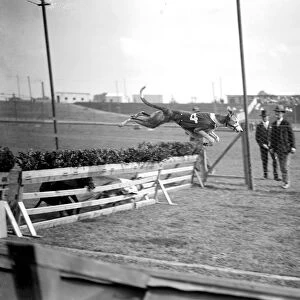 Trials at Harringay Greyhound Course. one of the dogs taking a hurdle