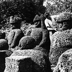 Trimming the topiary chess men in the garden at Hever Castle Near Edenbridge Kent 1962