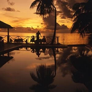 TROPICAL ISLANDS French Polynesia Hotel pool and sea at sunset, Morea, off Tahiti
