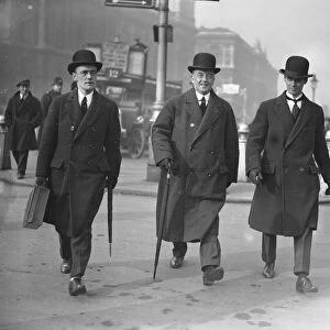 As they walk to the Houses of Parliament, Mr Arthur Henderson, MP, the Home Secretary