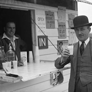 Whitbreads hop farm in Belting, Kent. A gentleman enjoys a cup of milk at the