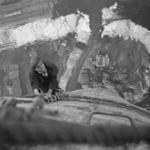A workman climbs up on of the chimneys of the new coal electric power station under