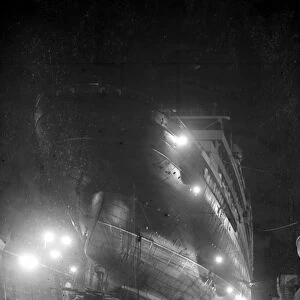 Workmen are now labouring day and night to repair the liner Aquitania in the new