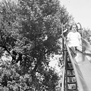 A young girl on a slide in Dartford, Kent. 1939