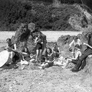 Young people enjoying a beach picnic in Jersey, Channel Isles. 11 September 1919