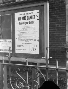 Air Raid Precautions notice instructing civilians to conceal their lights to reduce Air Raid Precautions notice instructing civilians to conceal their lights to reduce