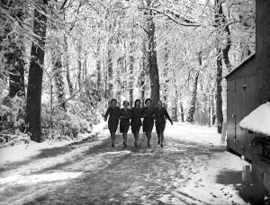ATS girls leaving their headquarters in Hastings, Sussex today found their surroundings ATS girls leaving their headquarters in Hastings, Sussex today found their surroundings